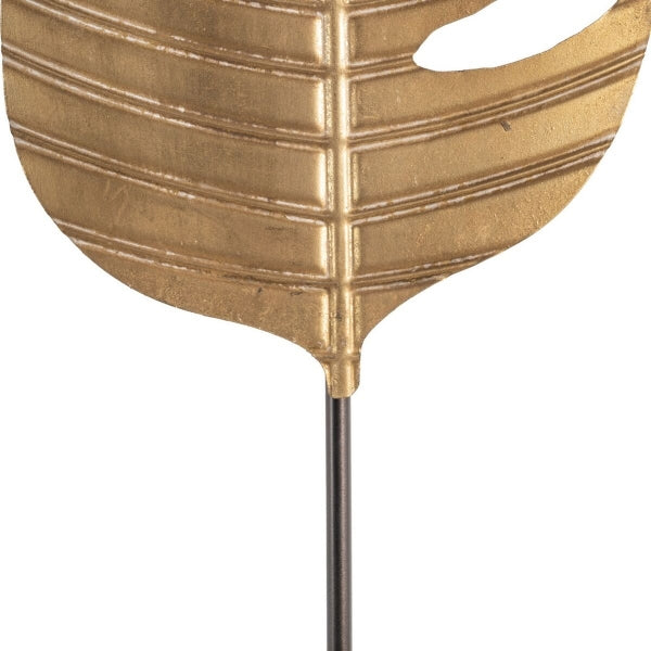 Lámpara de pie con diseño de hojas tropicales en metal dorado